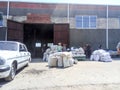 Granting of grain to the co-investors of landed property. Getting wheat and barley in bags in the warehouse. Royalty Free Stock Photo