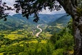 A village between emerald hills. The combination of green grass and blue sky leaves a special impression Royalty Free Stock Photo