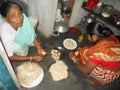 Village food processing by two older women