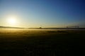 Village football field during foggy sunrise