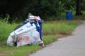 Village garbage dumps and bins placed on the roadside, waste recycling, waste separation concept.