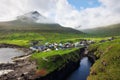 Village of Gjogv on Faroe Islands with colourful houses. Mountain landscape with ocean coast