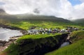 Village of Gjogv on Faroe Islands with colourful houses. Mountain landscape with ocean coast