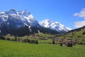 Village Gsteig bei Gstaad and snow covered mountains