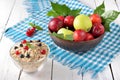 Village healthy breakfast: oatmeal, berries, apples and plums on Royalty Free Stock Photo