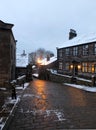 The village of heptonstall in the snow at night