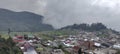 village in the highlands covered in cloud