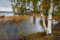 village house made of logs in the Kizhi Museum Reserve in the north of Russia on Lake Onega with docks and a pier in golden autum Royalty Free Stock Photo