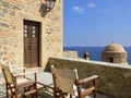 Village house terrace with folding chairs overlooking the Aegean Sea, Monemvasia, Greece Royalty Free Stock Photo