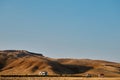 Village home on mountain foot, houses in front of a hill Royalty Free Stock Photo