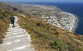 The village of Kamari in the island of Santorini, Greece, seen from way above at the entrance of the Ancient Village of Thera in a Royalty Free Stock Photo