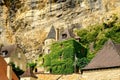 Village La Roque Gageac, France. Picturesque living house in the village under rocks.