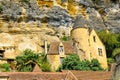 Village La Roque Gageac, France. Picturesque living house in the village under rocks.