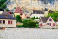 Village La Roque Gageac, France. Picturesque living houses in the village under rocks.