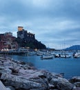 The village of Lerici by night with a view of the port and the medieval castle Lerici