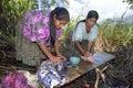 Village life Indian mother and daughter wash laundry