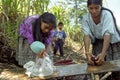 Village life Indian mother and daughter wash laundry