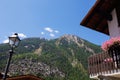 Village of Lillaz in Cogne in the Aosta Valley in the Italian Alps Mountains - Balcony of a Mountain House with Pink Flowers - Royalty Free Stock Photo