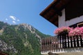 Village of Lillaz in Cogne in the Aosta Valley in the Italian Alps Mountains - Balcony of a Mountain House with Pink Flowers - Royalty Free Stock Photo