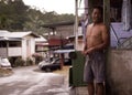 Village man standing in front of his house from Kuching, Malaysia Royalty Free Stock Photo