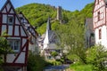 View at river elz, half-timbered houses and castle Loewenburg in the background Royalty Free Stock Photo
