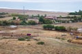 Village and nature. Houses and roofs. Green shrubs. Travel phot