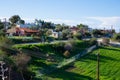 Village and nature. Houses and roofs. Green shrubs. Travel phot