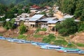Idyllic Village Nong Khiaw with vessels at the river, Laos
