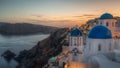 Village of Oia with white cave houses and churches with blue domes overlooking the beautiful sea Royalty Free Stock Photo