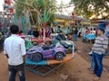 village people looking at car swing at fair in India January 2020 Royalty Free Stock Photo