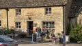 Village post office and cafe customers seated outside, UK Royalty Free Stock Photo