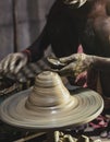 A village potter makes clay pottery