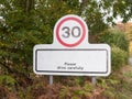 Village rectangle sign with 30 miles per hour speed limit Royalty Free Stock Photo