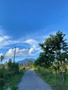 Village road with mountain views Royalty Free Stock Photo
