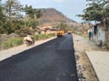 village road repair using hotmix asphalt Royalty Free Stock Photo