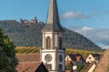 Village of Rorschwihr in Alsace on the wine route with the Haut Koenigsbourg castle in the background