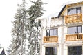 village rural house,mansion,hotel covered in snow,icicles in winter forest mountains Royalty Free Stock Photo