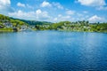 Village Rurberg at Eifel National Park, Germany. Scenic view of lake Rursee and houses in the background