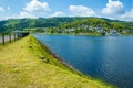 Village Rurberg at Eifel National Park, Germany. Scenic view of lake Rursee, Paulushofdamm and small town in the background