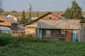 A village in Russia in summer, an original old wooden village house, an original authentic disappearing village life. Rural landsc