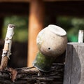 Village,rustic wattle fence, old clay jug. Rural scene