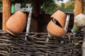 Village, rustic wattle fence, old clay pots . Rural scene