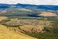 The village of Shigaevo in the southern Urals against the backdrop of mountains Royalty Free Stock Photo
