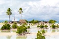 Village on South Tarawa atoll, Kiribati, Gilbert islands, Micronesia, Oceania. Thatched roof houses. Rural life, a remote paradise