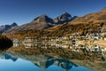 Village of St. Moritz in Switzerland with fall color reflections and mountain landscape