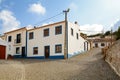 Village street with residential buildings in the town of Bordeira near Carrapateira, in the municipality of Aljezur Royalty Free Stock Photo