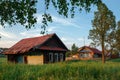 Village street in summer. Abandoned log house. Village of Visim, Sverdlovsk region, Russia Royalty Free Stock Photo