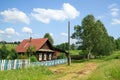 Village street in summer. Beautiful log house. Village of Visim, Sverdlovsk region, Russia Royalty Free Stock Photo