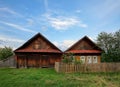 Old wooden house with barn and beautiful carved windows in the ancient village of Visim, Sverdlovsk region, Urals, Russia Royalty Free Stock Photo