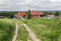 Village street in summer. Traditional wooden houses. Village of Visim, Russia Royalty Free Stock Photo